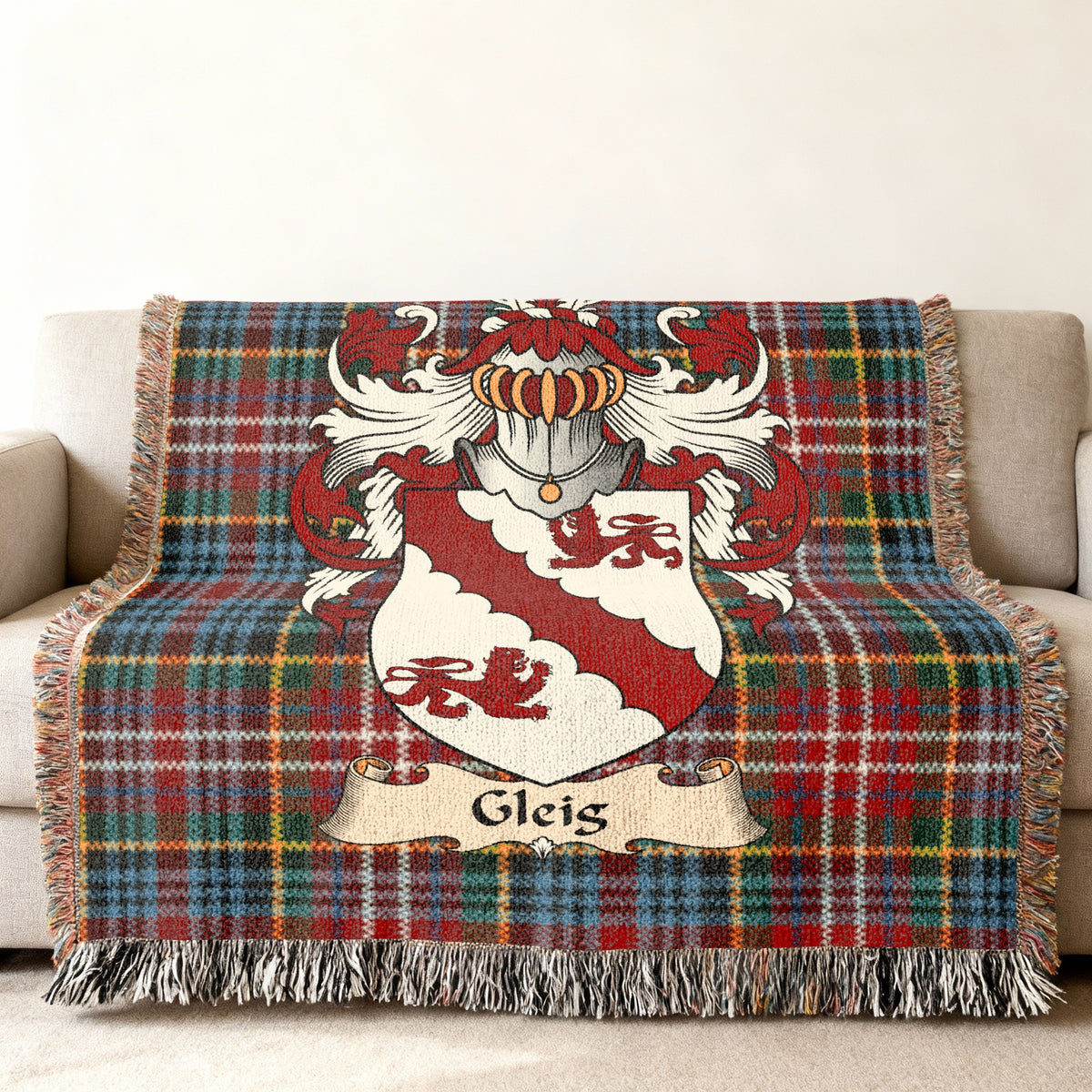 Gleis family crest emblem on a Caledonia tartan woven blanket