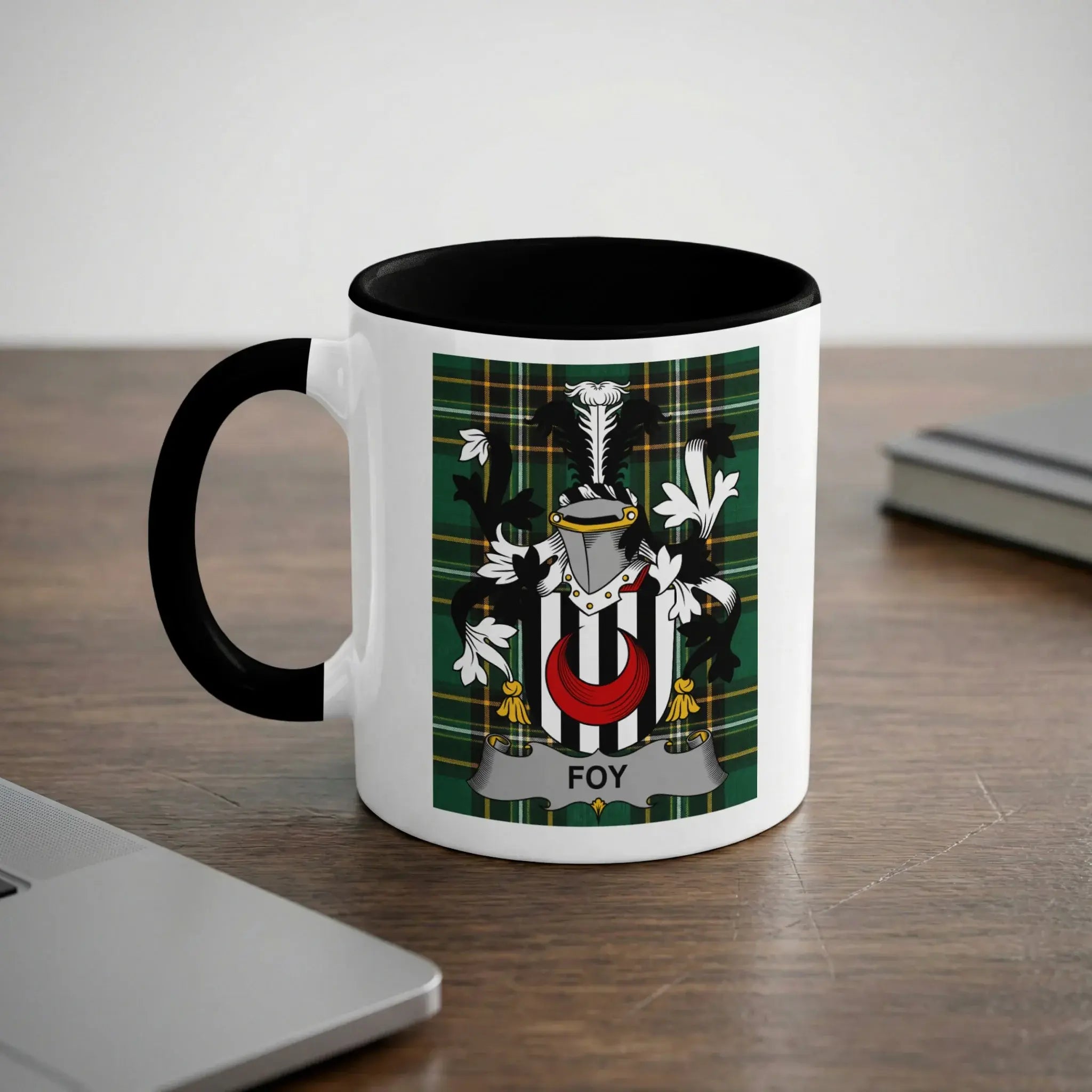 White mug with black rim and handle featuring a family crest with the name "Foy".