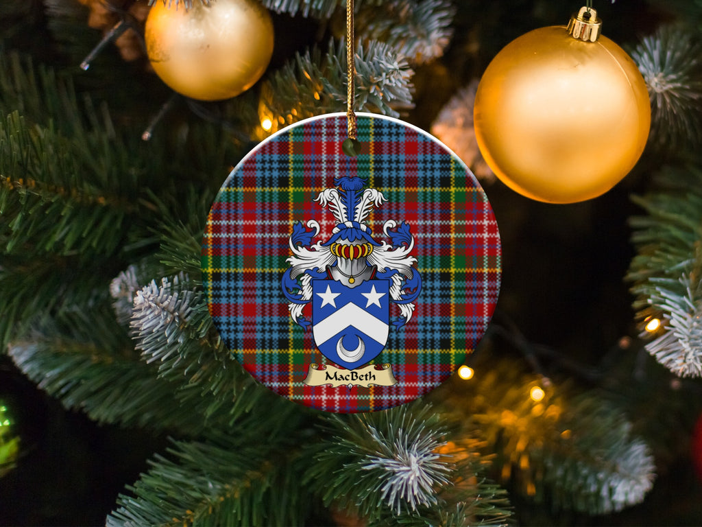 MacBeth family emblem ceramic Christmas ornament with Caledonia tartan background in festive holiday décor