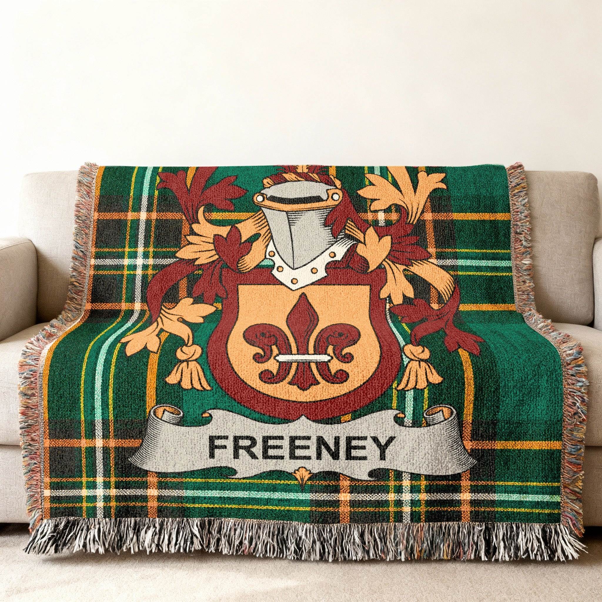 Freeney family crest on a green plaid woven throw blanket.