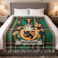 Tartan blanket with Vaughan crest draped on a bed.