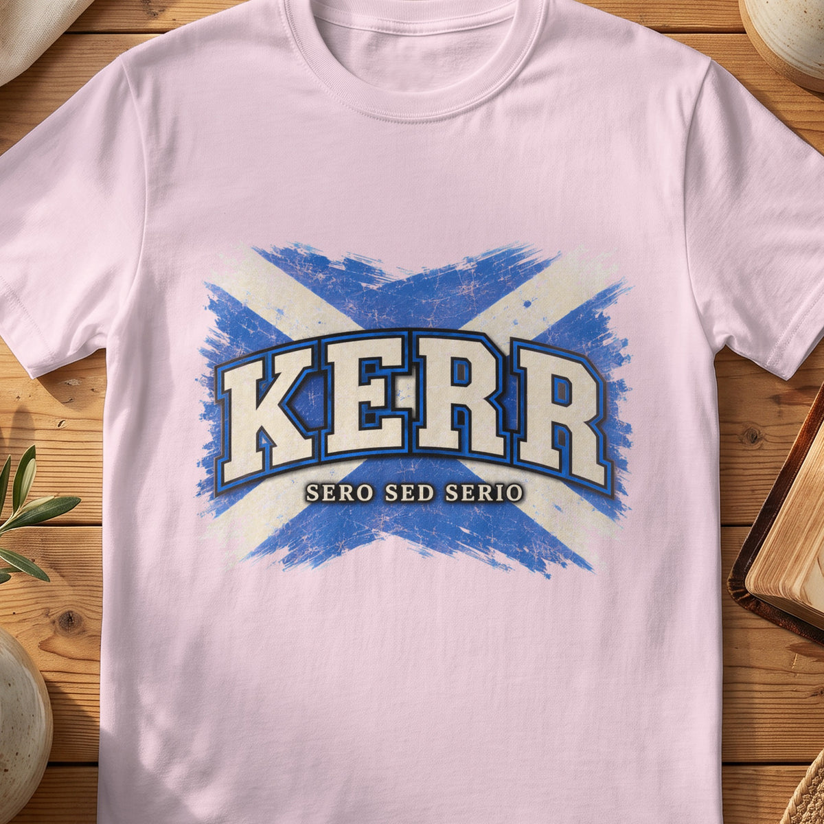 Kerr Scottish Saltire T-shirt in Light Pink, with distressed blue and cream flag and “Sero Sed Serio” lettering.
