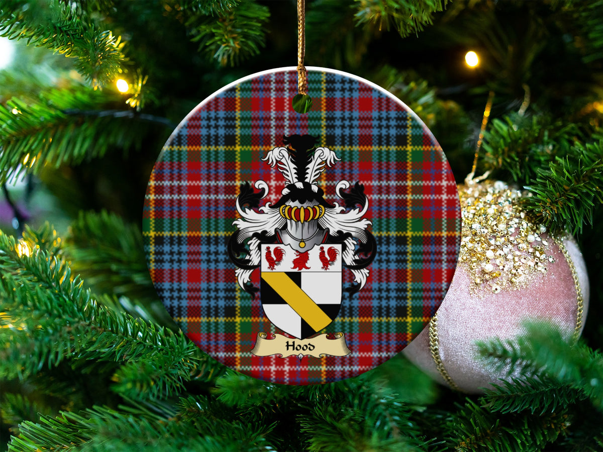 Hood Scottish clan ceramic ornament with family crest on a Caledonia tartan background, hanging on a Christmas tree