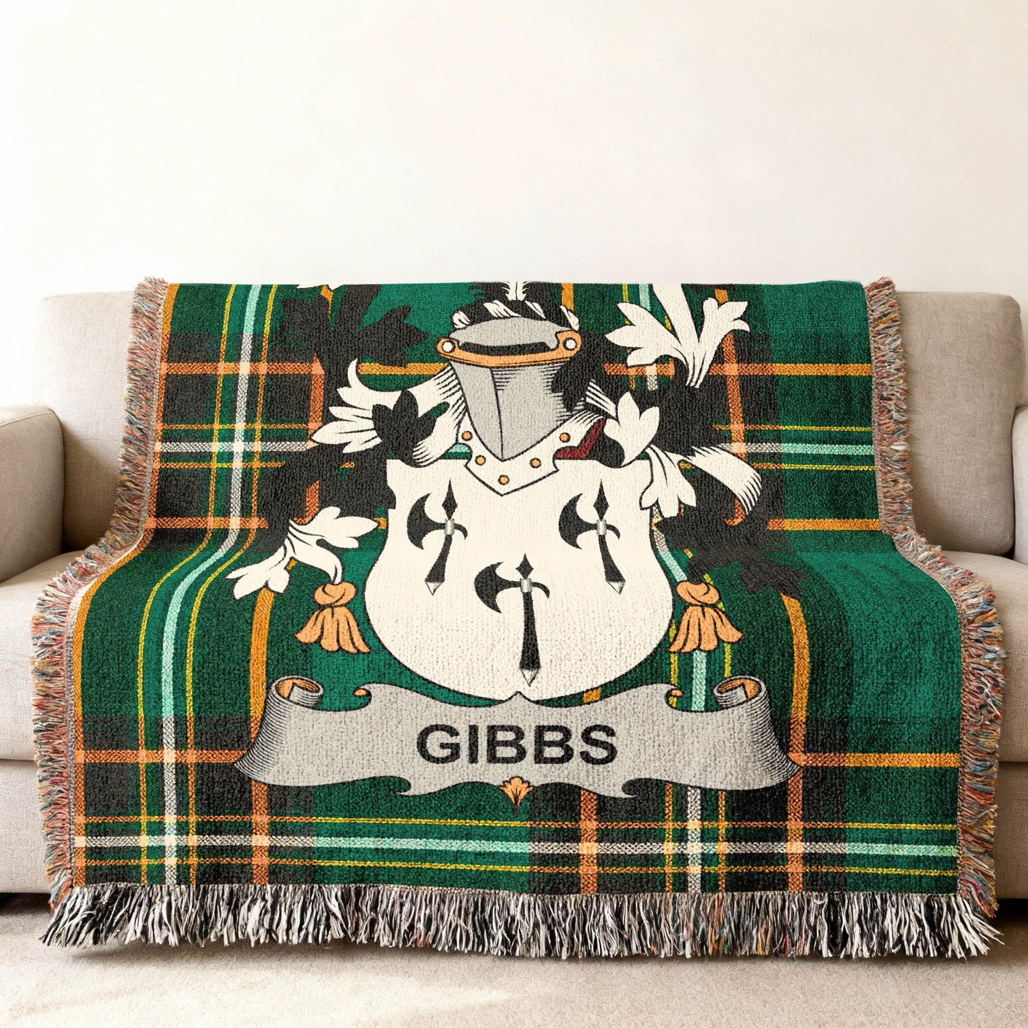 Woven blanket with green plaid and a white crest with "GIBBS" text.