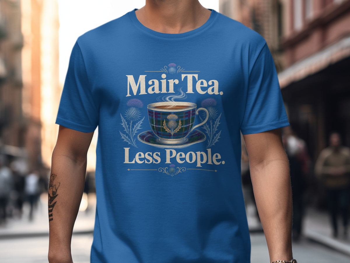 Blue t-shirt with text "Mair Tea. Less People." and a teacup.