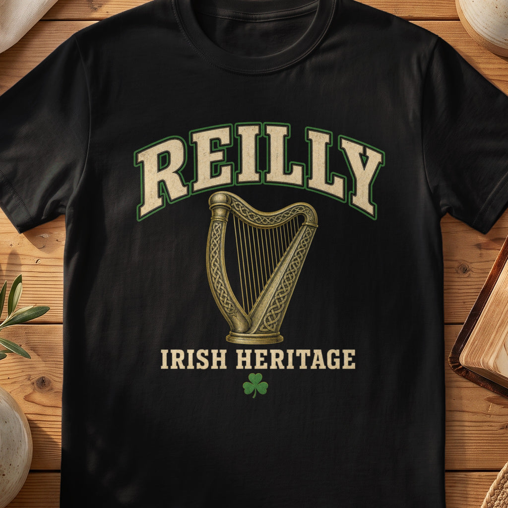 Reilly Irish harp T-shirt in Black, with cream surname lettering, a gold-toned harp, green shamrock and “Irish Heritage” text.