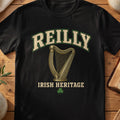 Reilly Irish harp T-shirt in Black, with cream surname lettering, a gold-toned harp, green shamrock and “Irish Heritage” text.