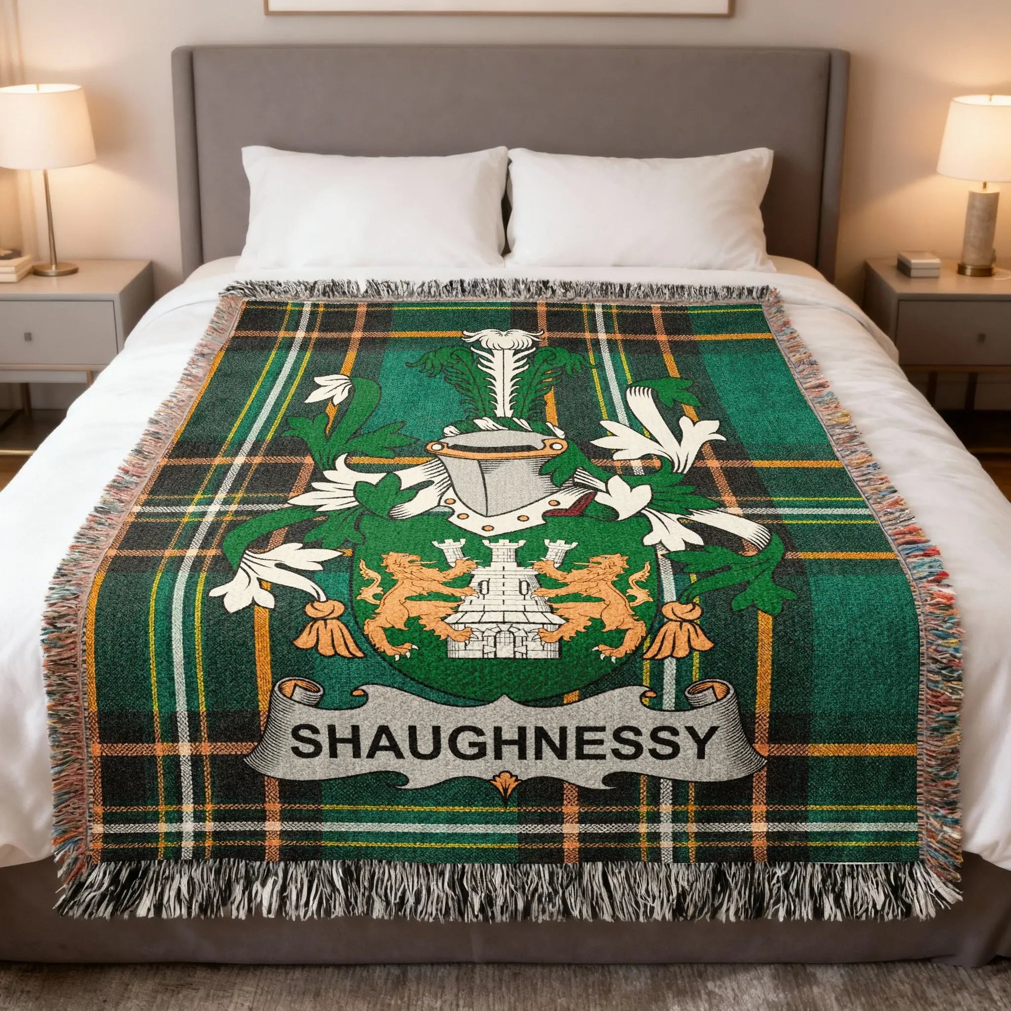 Green plaid throw blanket with Shaughnessy crest and lions.