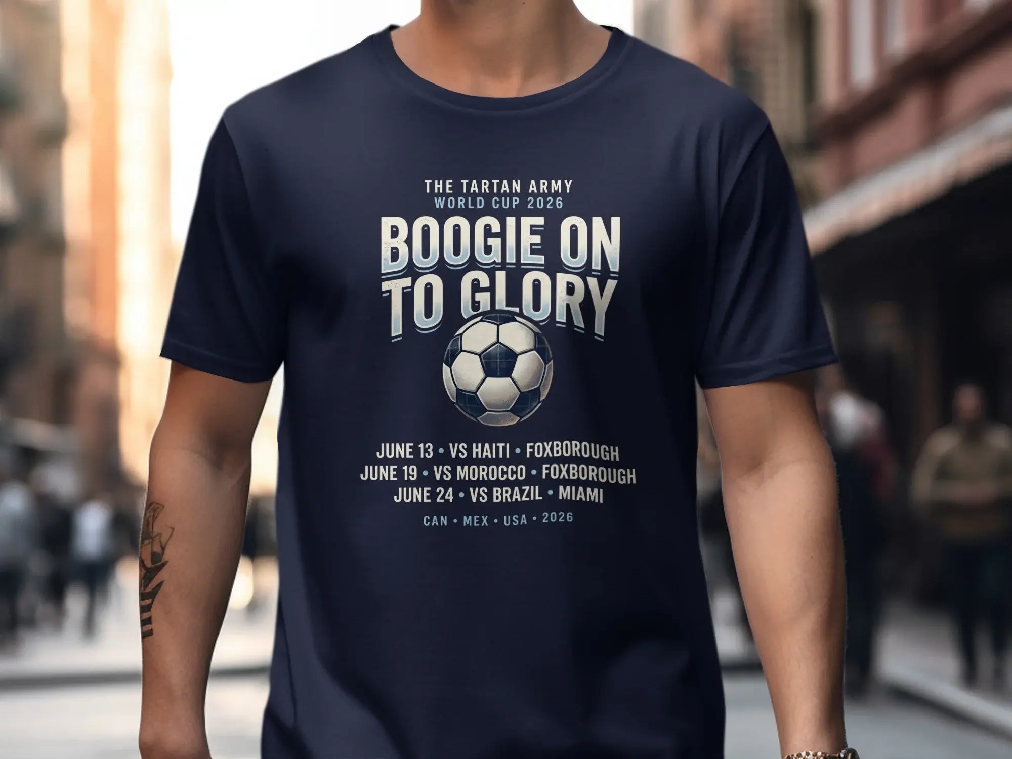 Navy t-shirt with "Boogie On To Glory" World Cup 2026 schedule.