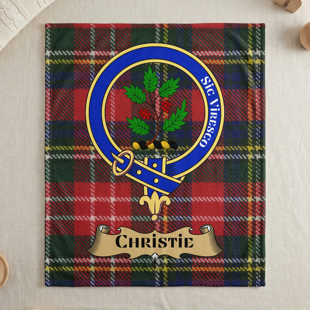 Christie clan tartan throw blanket with crest and motto — draped display