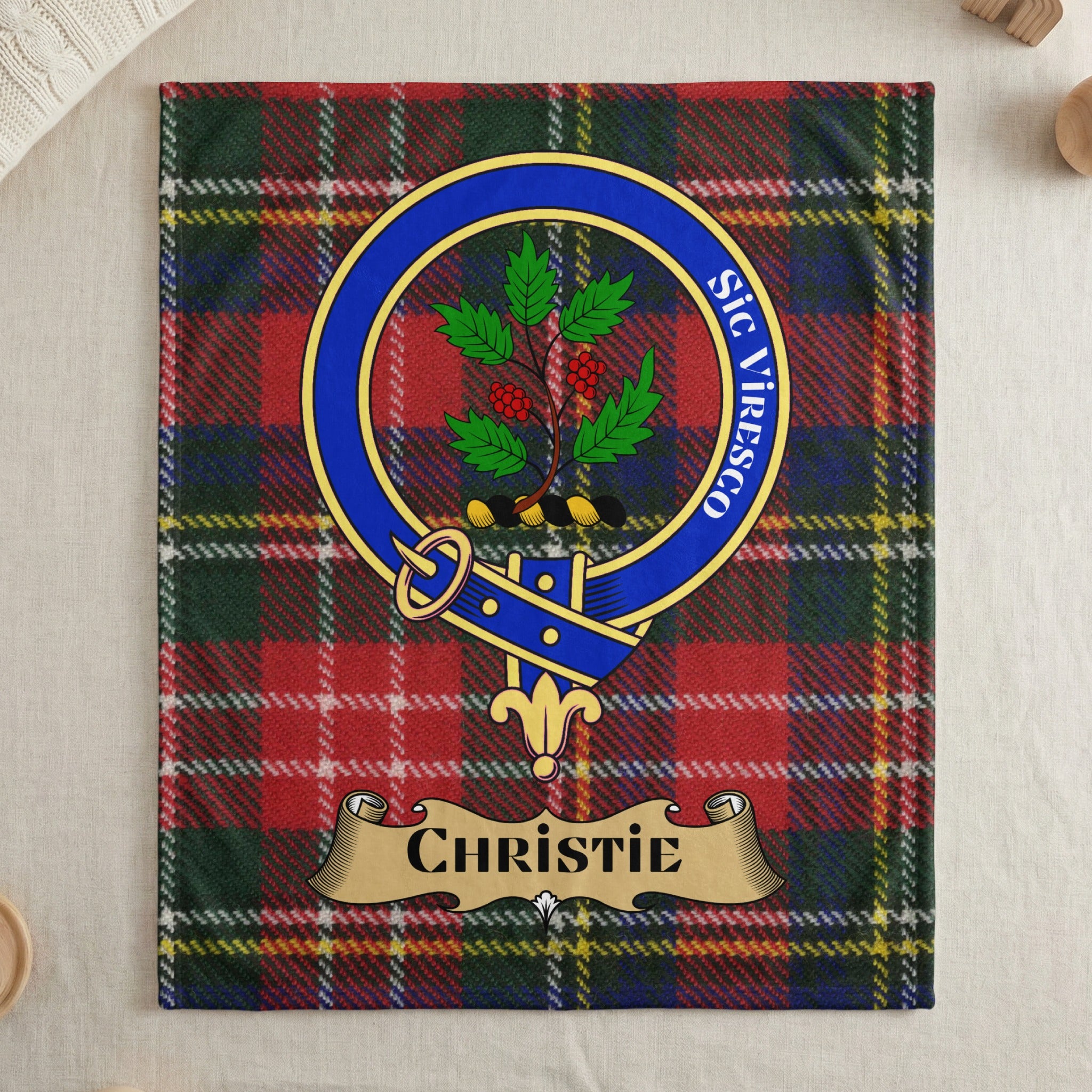 Christie clan tartan throw blanket with crest and motto — draped display