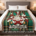 Green tartan blanket with Fitz-Gibbon crest.