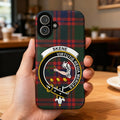 Clan Skene tartan phone case — glossy edge-to-edge virtutis regia merces crest print, iPhone shown