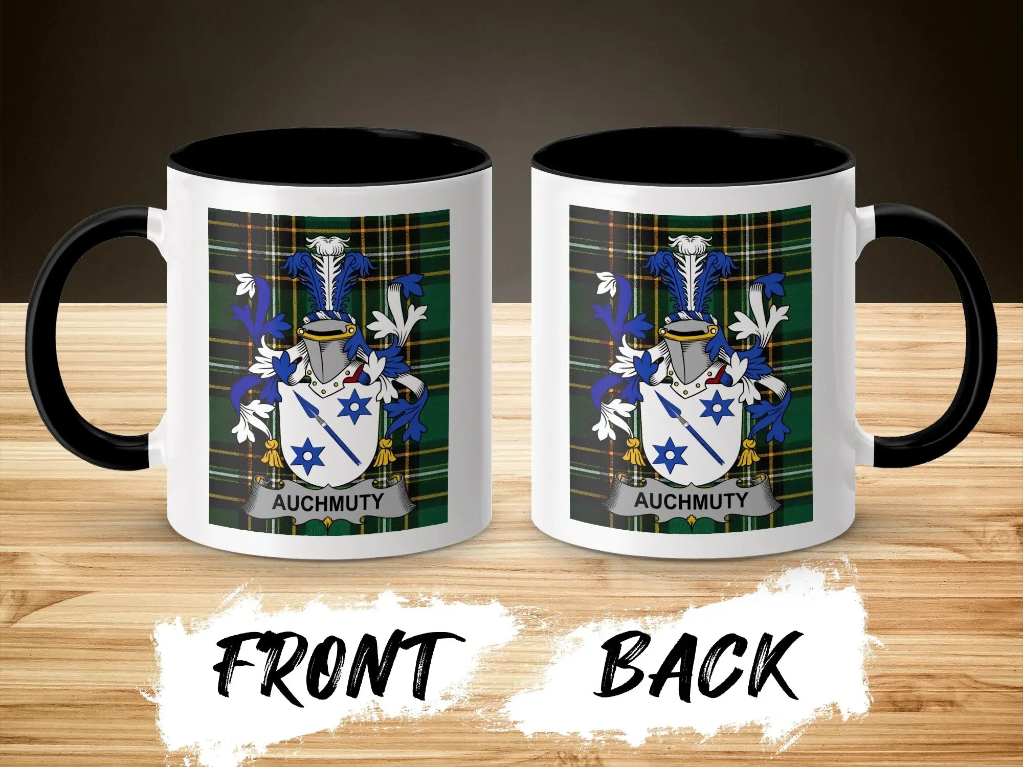 Two white mugs with black handles, displaying the Auchmuty coat of arms on a plaid background.