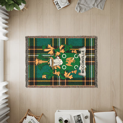 Green and orange plaid throw with McCORVILLET crest and fringe.
