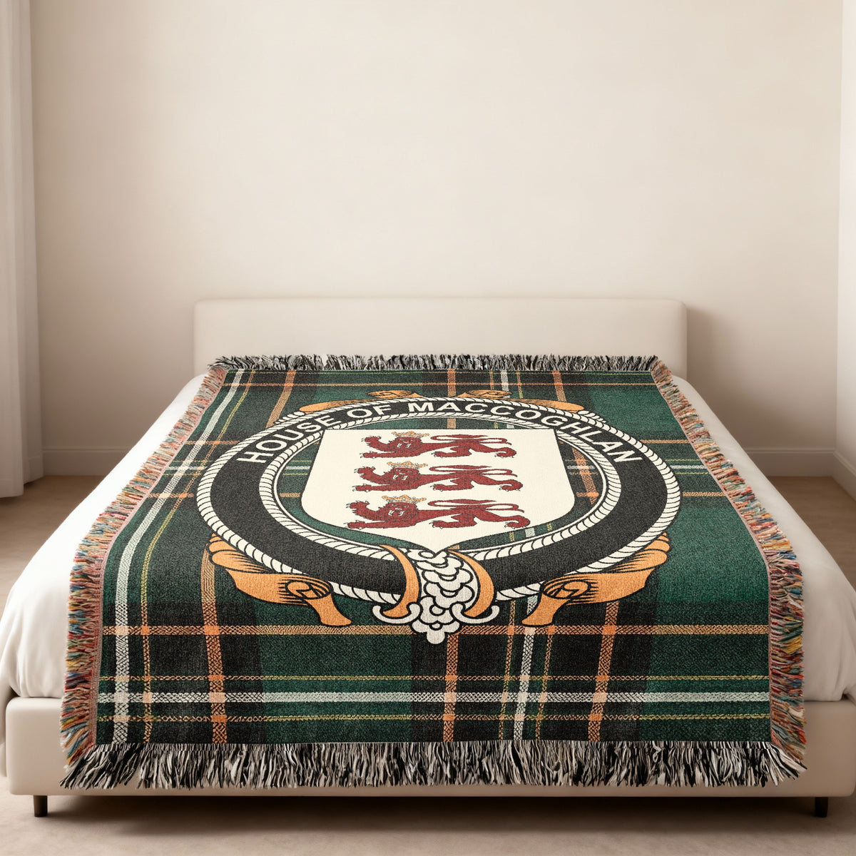 MacCoghlan family crest emblem woven blanket displayed on a bed