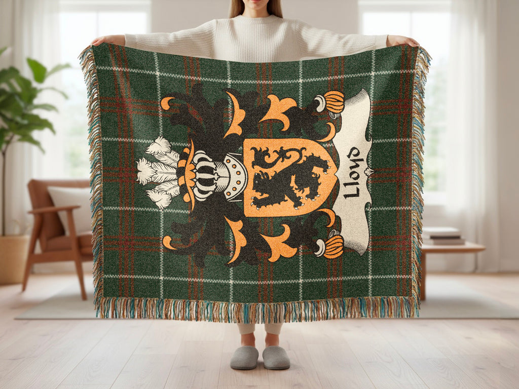 Green plaid throw blanket with a shield crest and "Lloyd" text.
