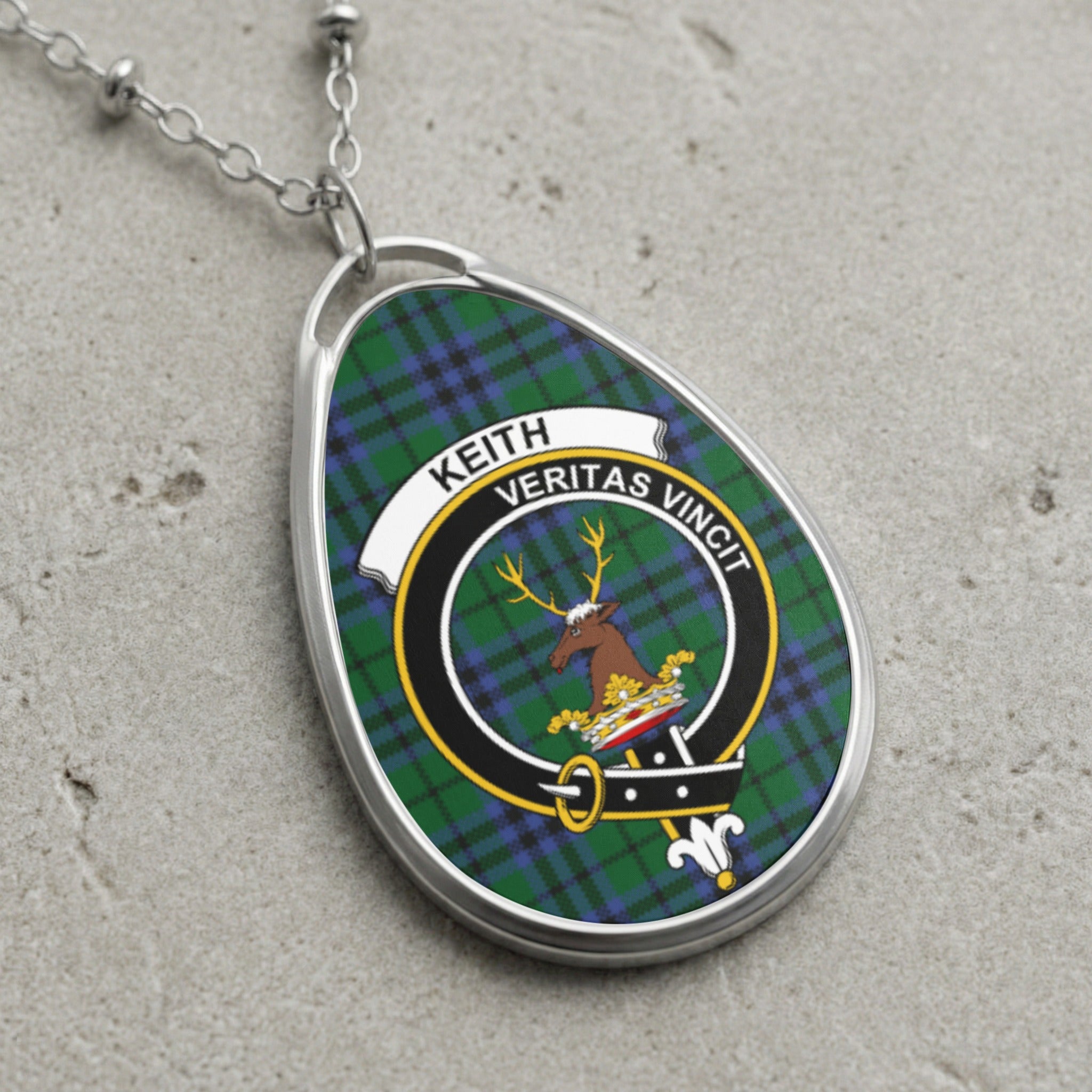 Keith clan Scottish tartan necklace with clan crest and Veritas Vincit motto on tartan background
