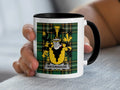 White mug with black handle featuring a Scottish tartan pattern and a coat of arms with "WATERHOUSE" text.
