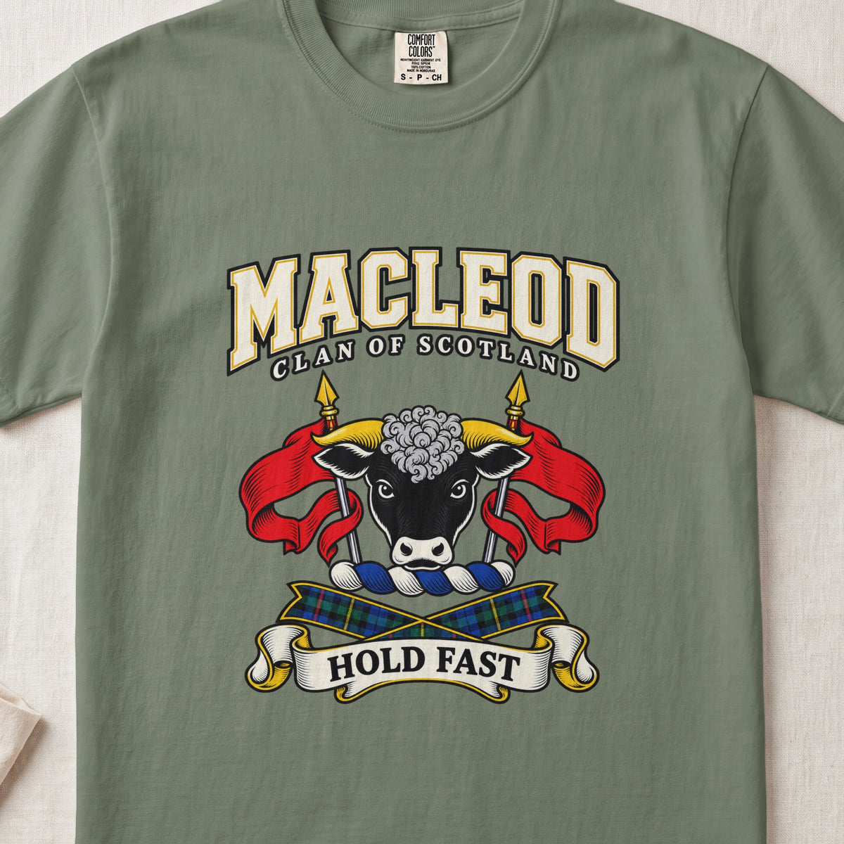 MacLeod graphic T-shirt in Moss green, front flat lay showing varsity lettering and black bull head with gold horns and white forehead curls.