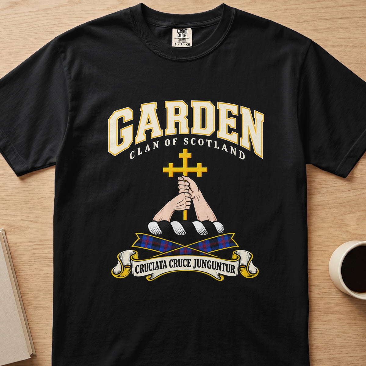 Garden clan T-shirt in black, front view with hands holding a gold cross
