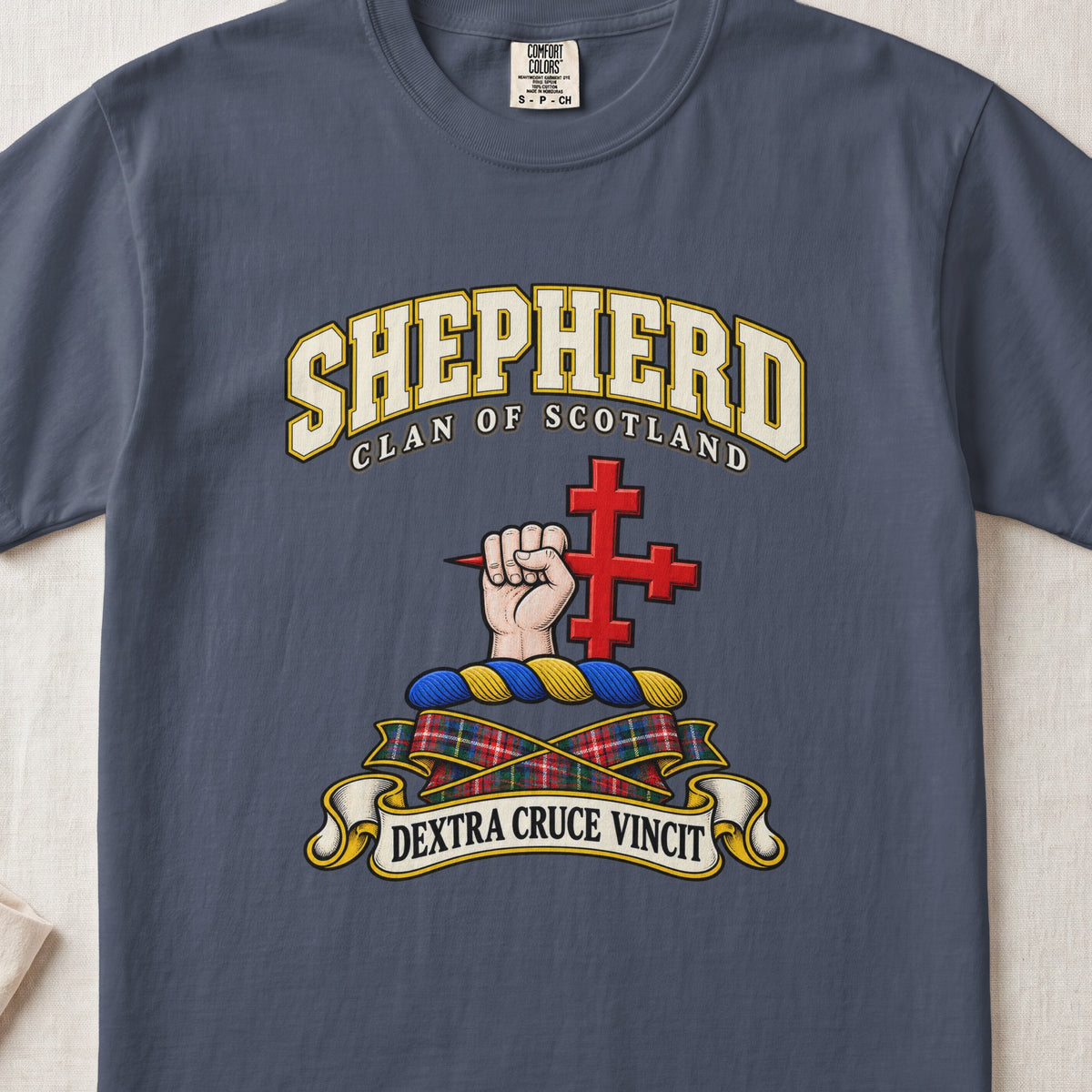 Shepherd Scottish clan T-shirt in Midnight, front view with a hand holding a red cross and motto banner.