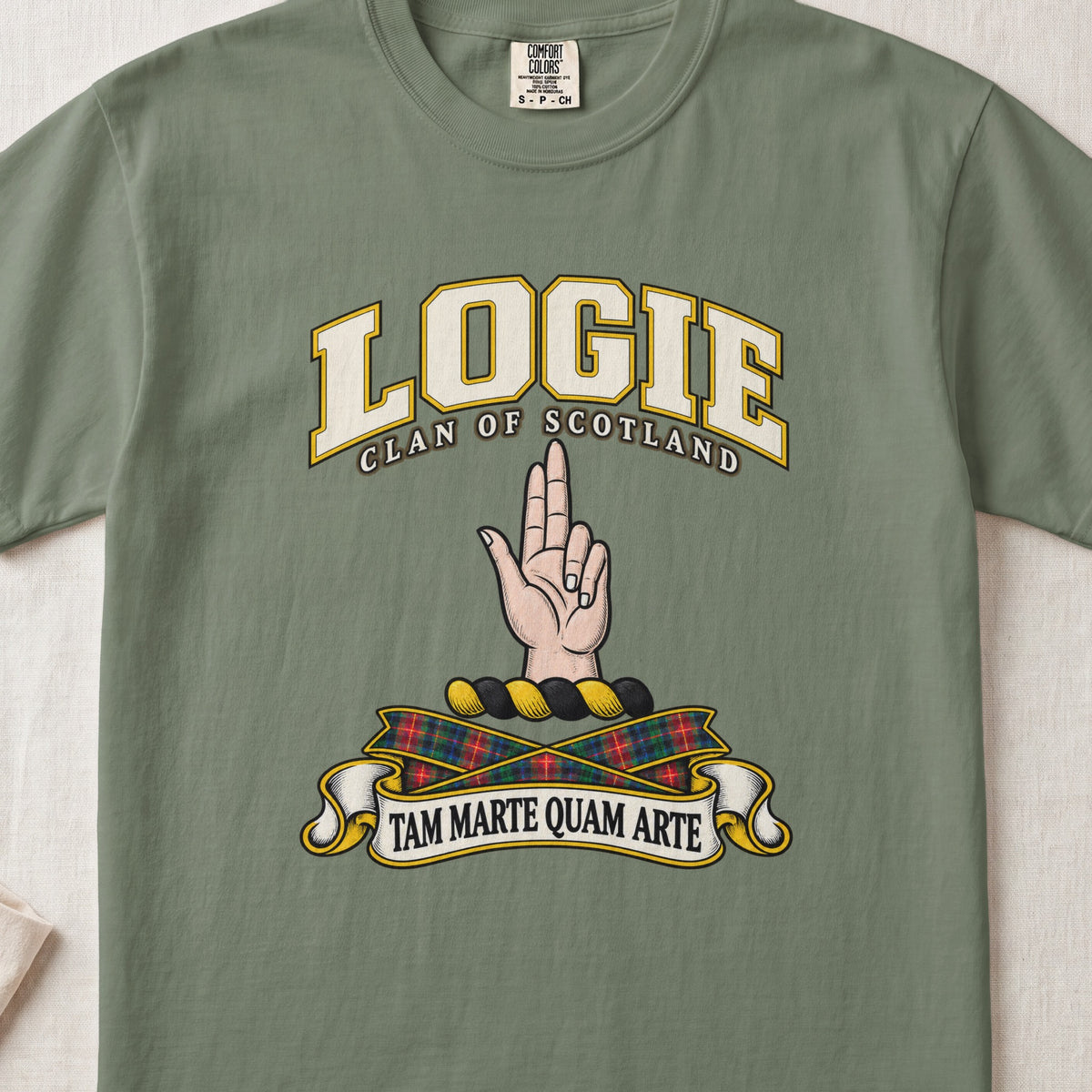 Logie Scottish clan T-shirt in Moss, front view with a raised hand with two fingers extended and motto design.