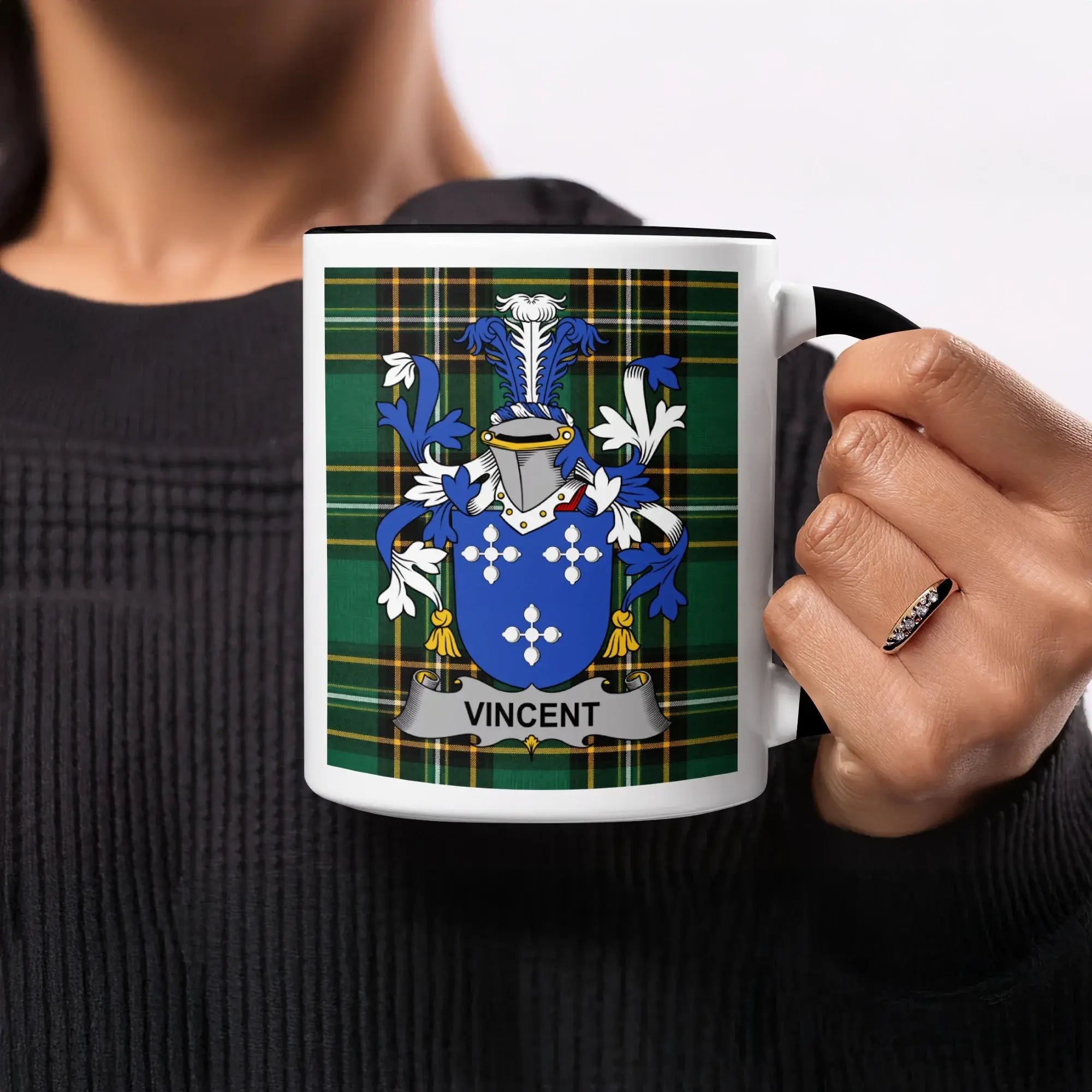 Mug with Vincent family crest on green plaid background.