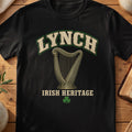 Lynch Irish harp T-shirt in Black, with cream surname lettering, a gold-toned harp, green shamrock and “Irish Heritage” text.