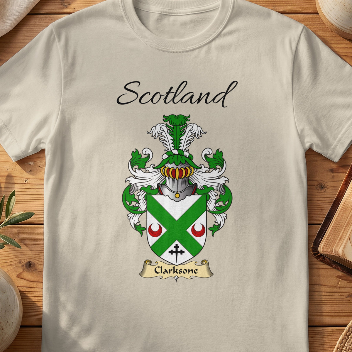 Sand Clarksone Scottish family shield T-shirt featuring a green diagonal cross between red crescents