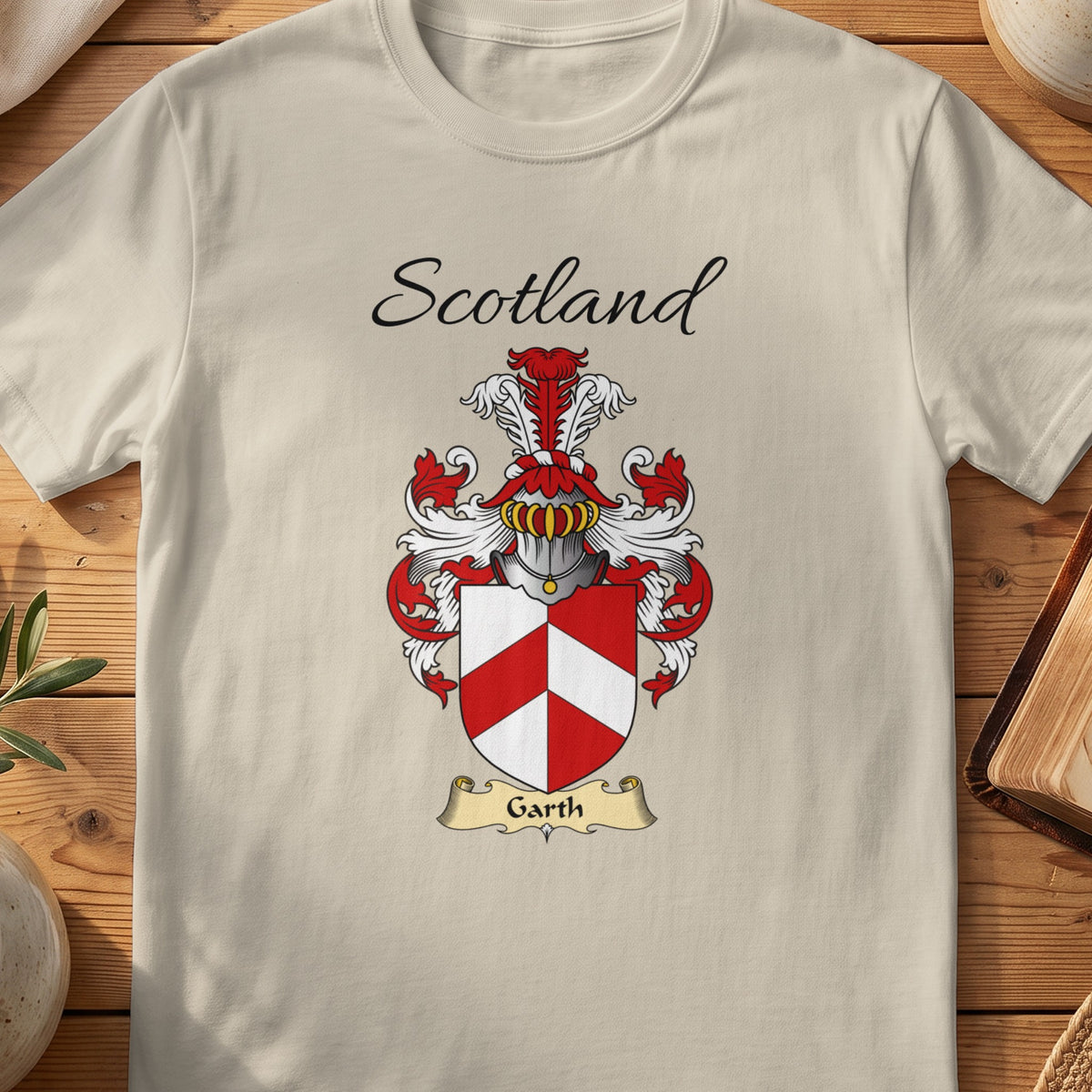 Sand Garth Scottish family shield T-shirt featuring a red-and-white geometric chevron design