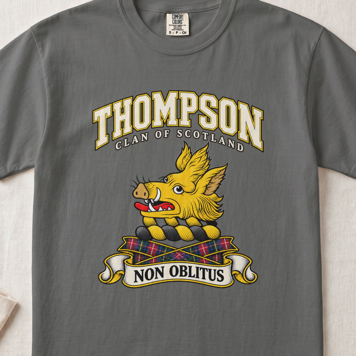 Thompson Scottish clan T-shirt in Pepper, front view with a golden boar head and motto banner.