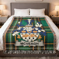 McVEAGH family crest on a green tartan blanket with fringe.