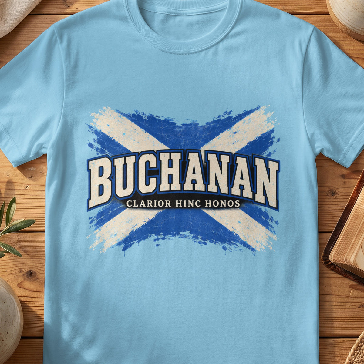 Buchanan Scottish Saltire T-shirt in Sky, with distressed blue and cream flag and “Clarior Hinc Honos” lettering.