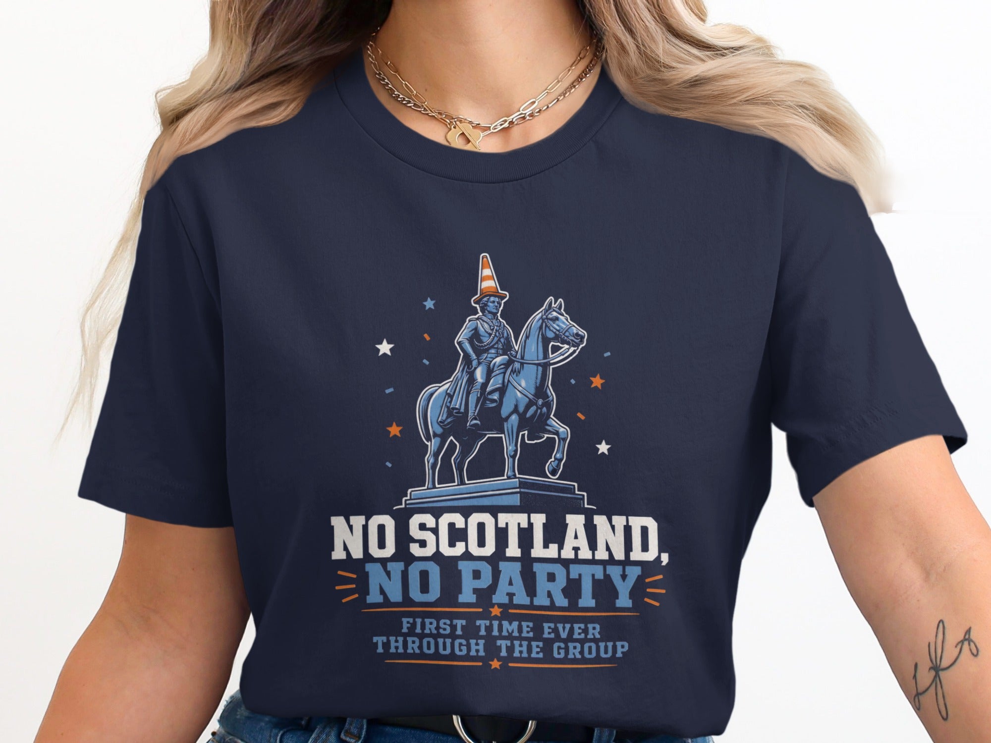 Dark blue t-shirt with a graphic featuring a horse and rider under stars, wearing a party hat.