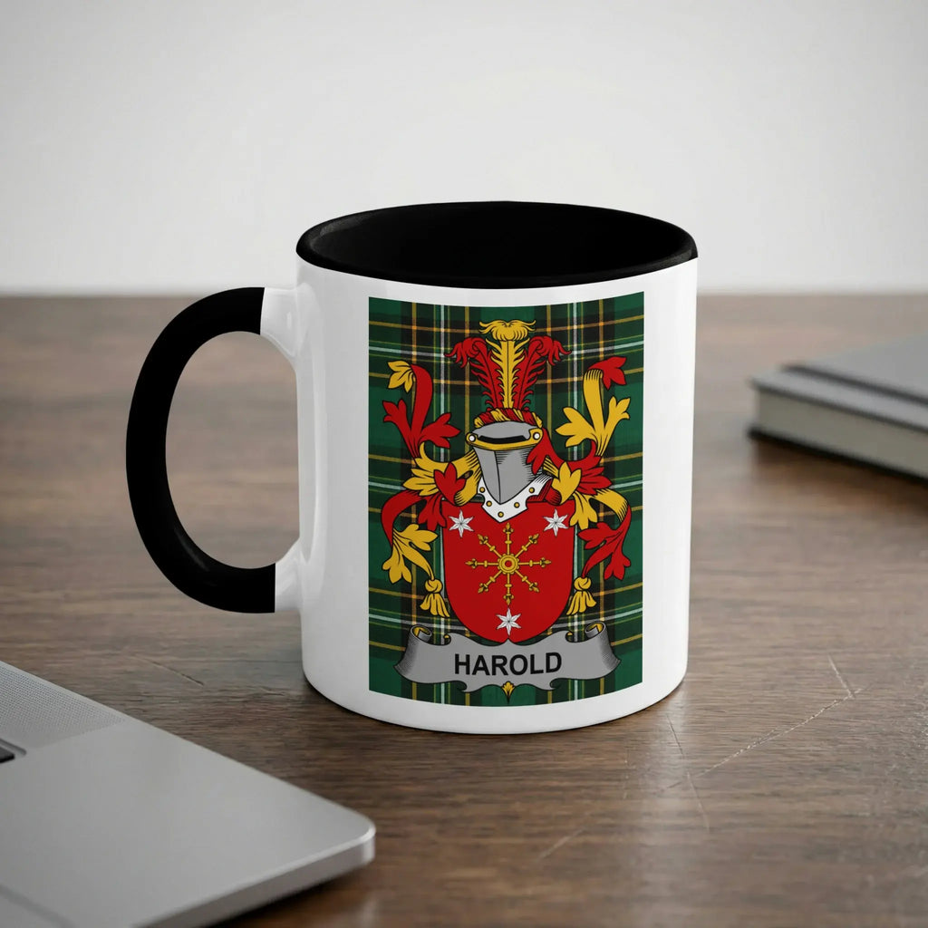 White mug with black handle featuring the Harold family crest on a tartan background.