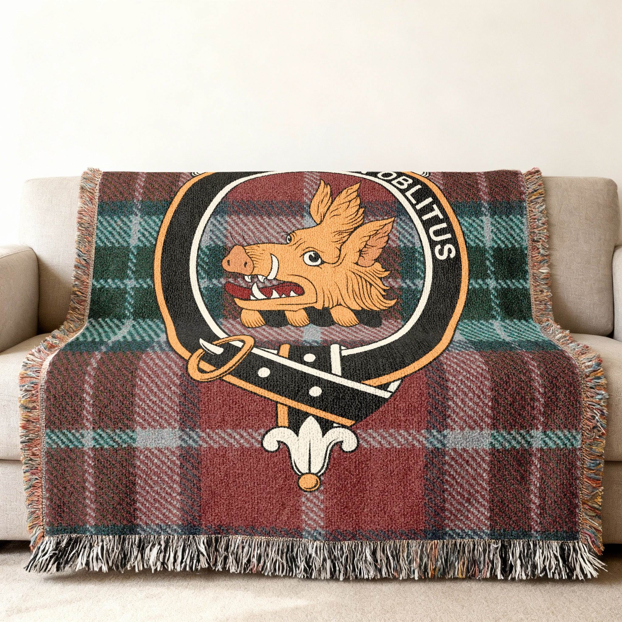 MacTavish Non Oblitus wild boar tartan woven blanket — close-up of crest woven in cotton plaid