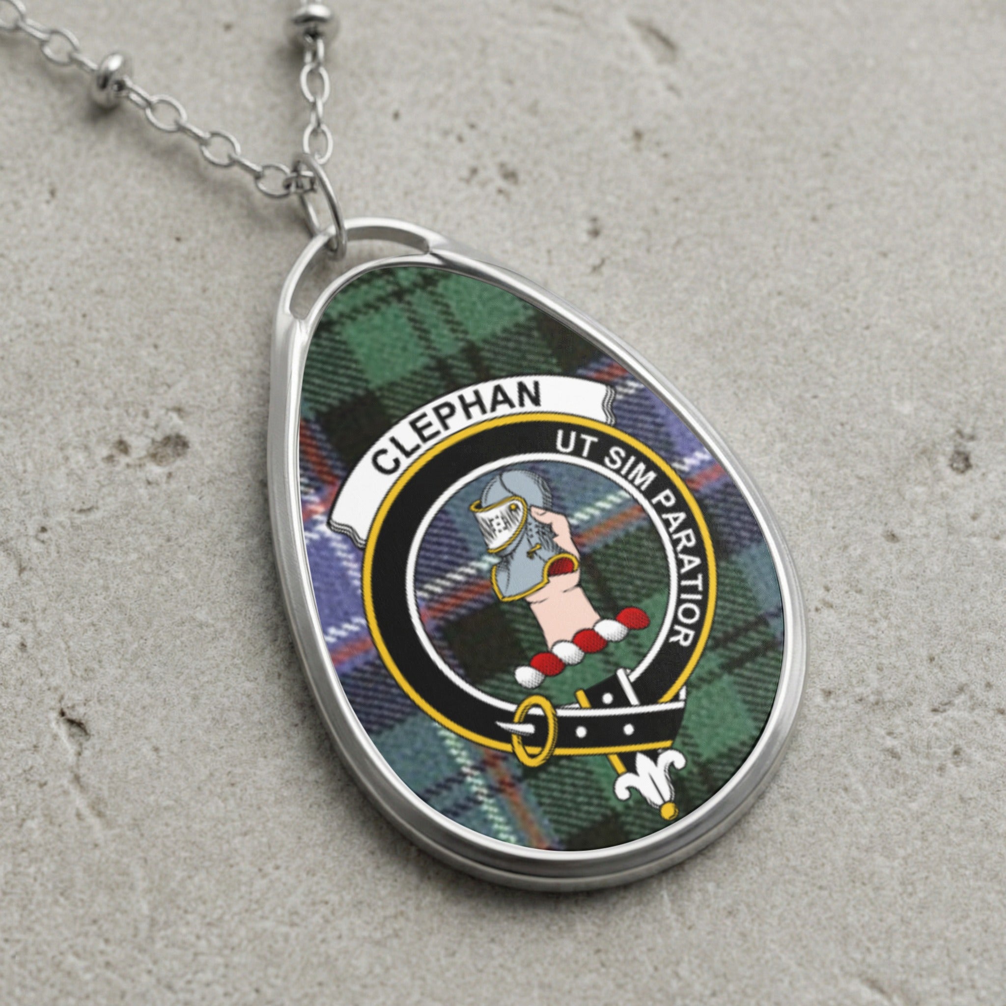 Clephan clan Scottish tartan necklace with clan crest on tartan background