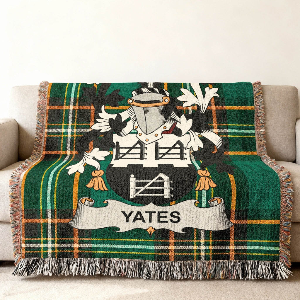 Green tartan throw blanket with Yates family crest.