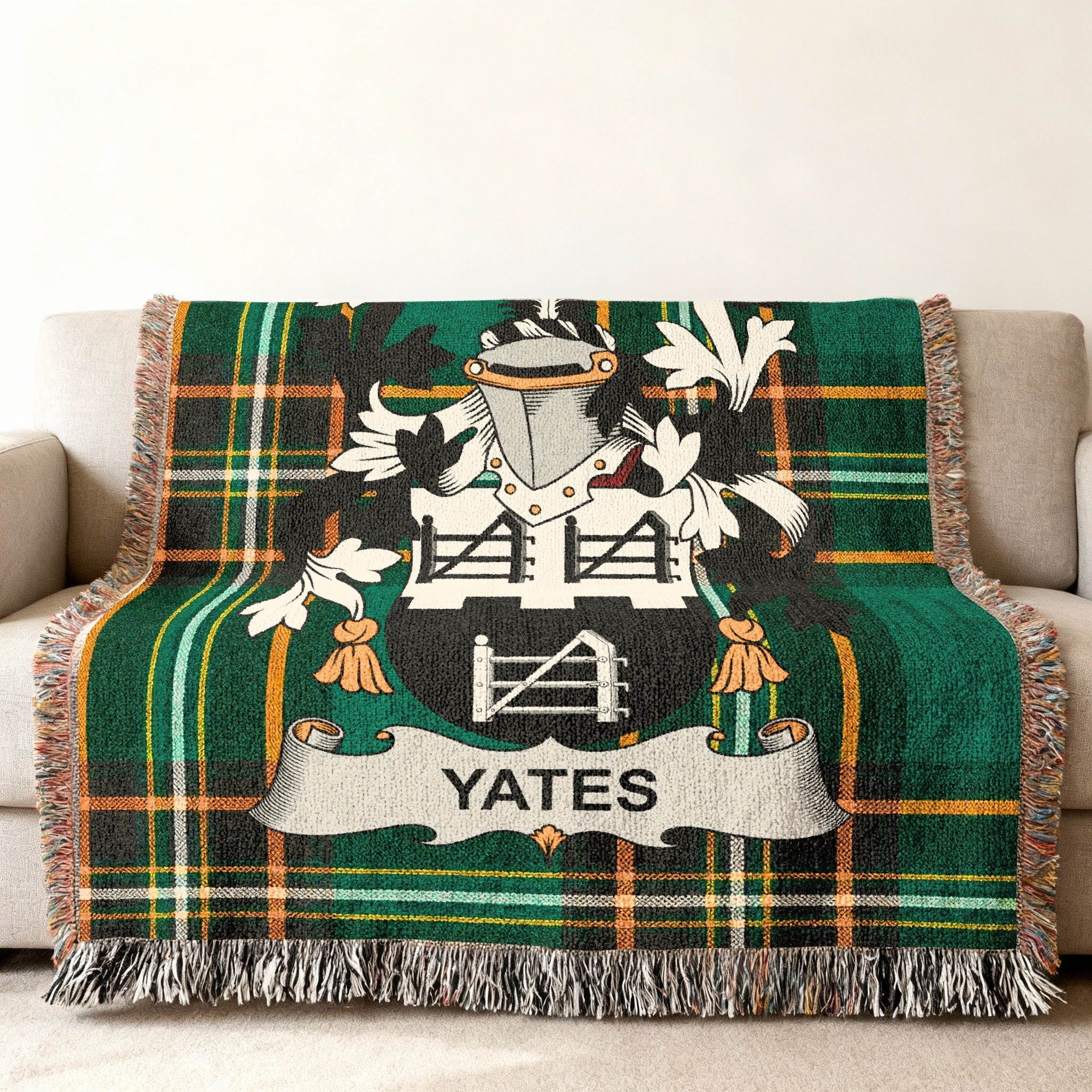 Green tartan throw blanket with Yates family crest.