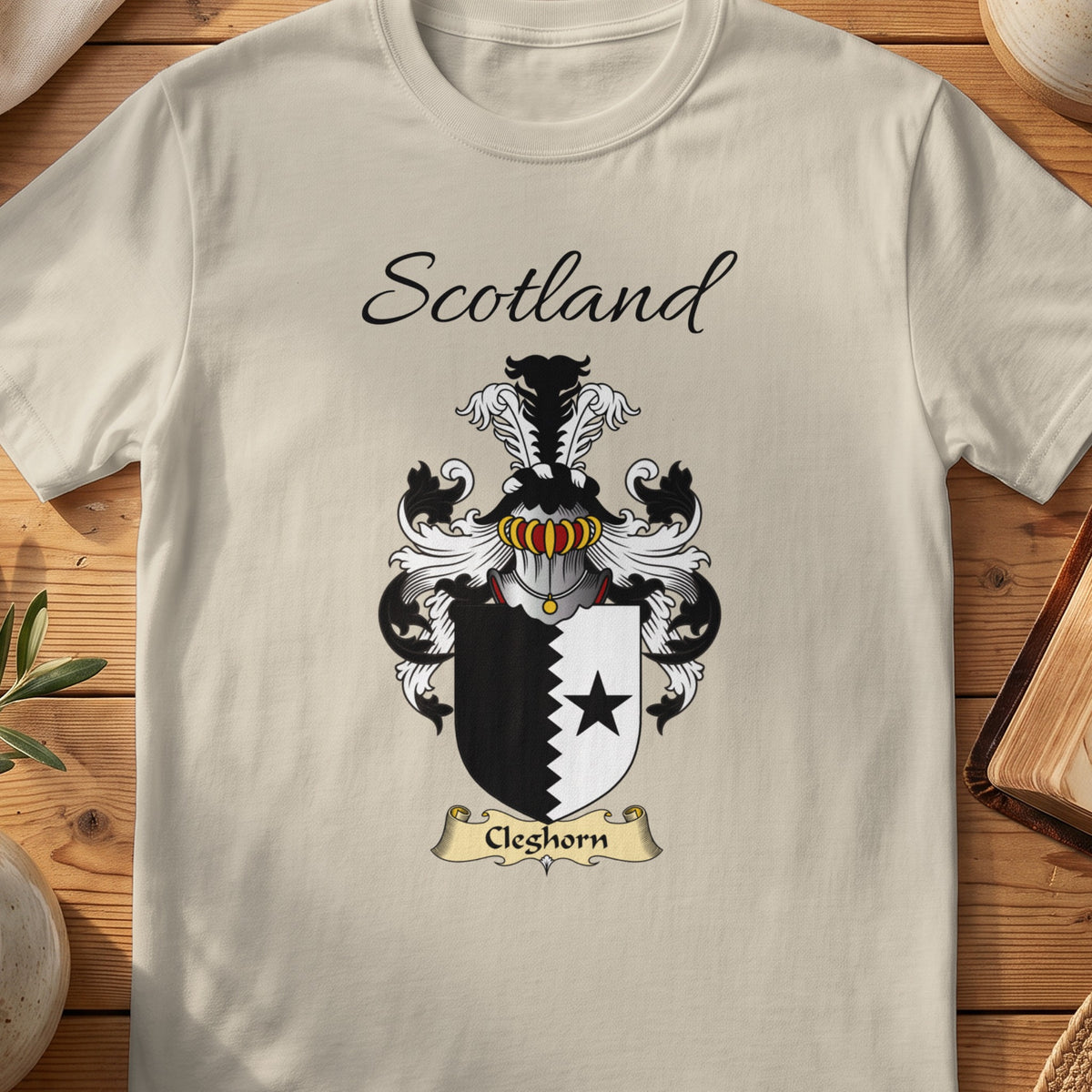 Sand Cleghorn Scottish family shield T-shirt featuring a black star beside a jagged black dividing line