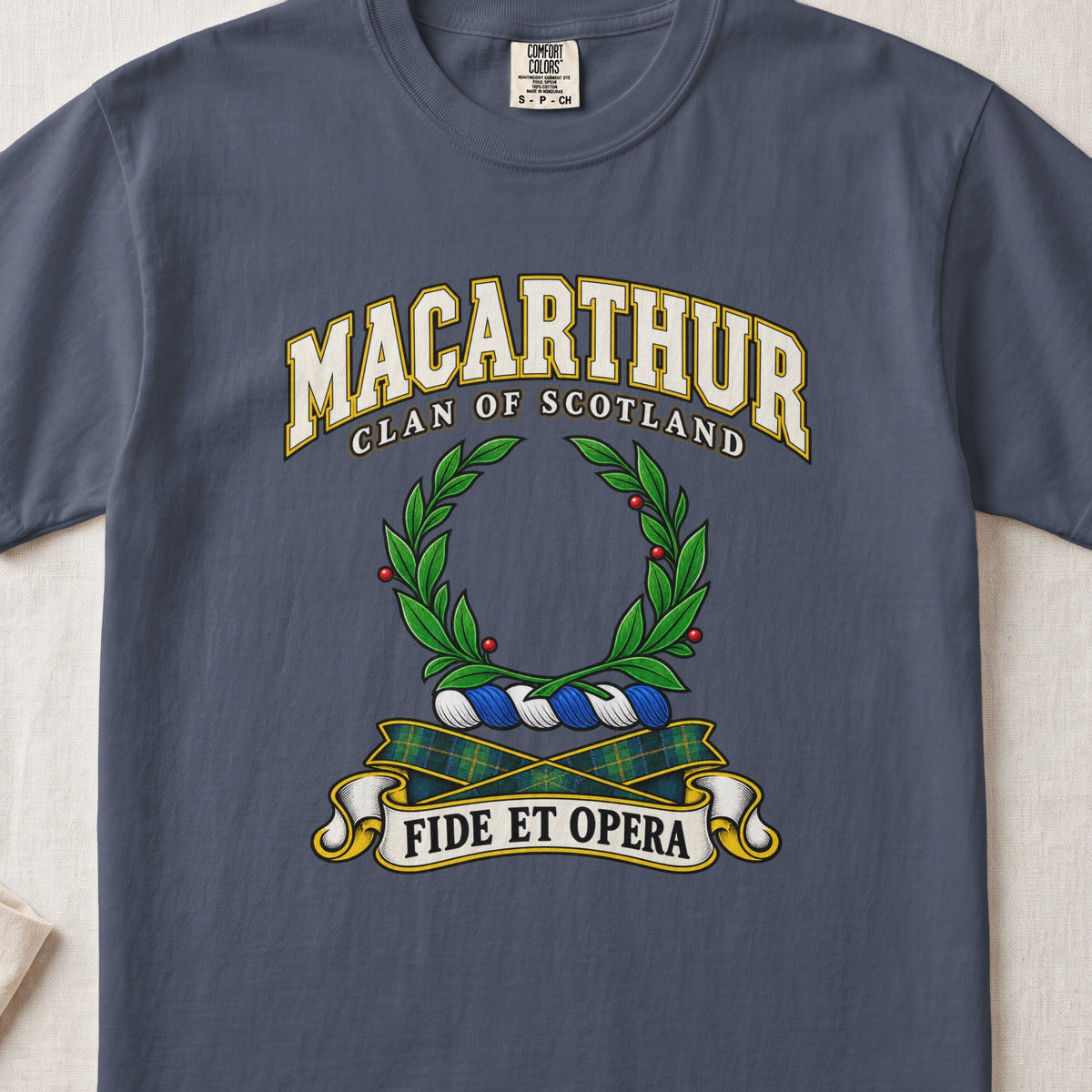 MacArthur Scottish clan T-shirt in Midnight, front view with a green laurel wreath and motto design.