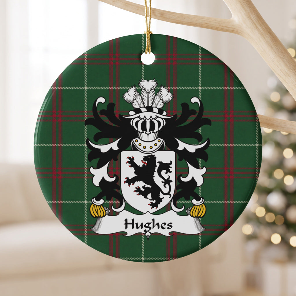 Hughes Style 2 ornament hanging from a pale wooden branch; a black lion on a white shield on Welsh national tartan.