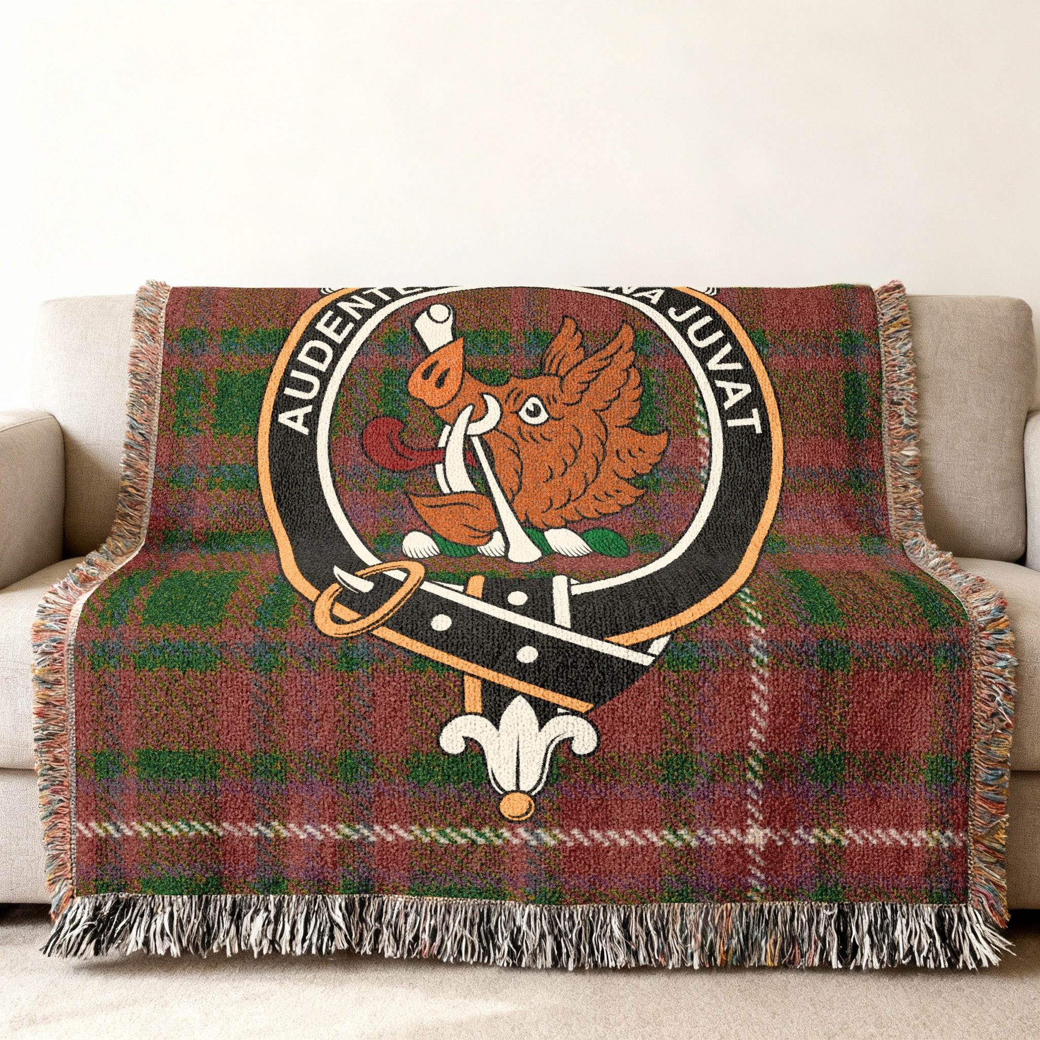 MacKinnon Scottish tartan woven blanket laid flat — wild boar crest and tartan pattern view