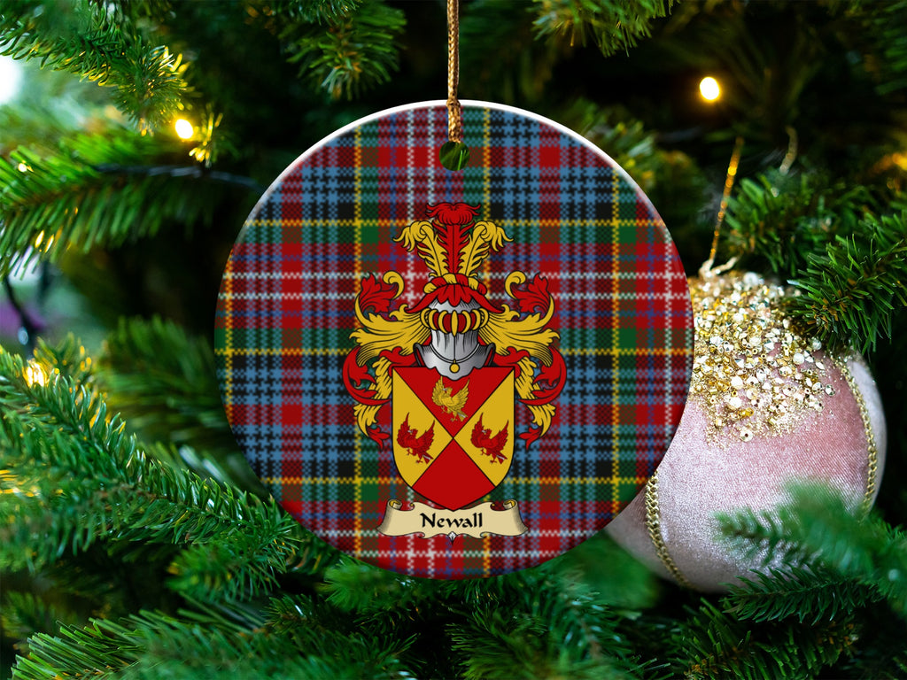 Newall Scottish clan ceramic ornament with family crest on a Caledonia tartan background, hanging on a Christmas tree