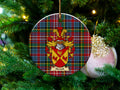 Newall Scottish clan ceramic ornament with family crest on a Caledonia tartan background, hanging on a Christmas tree