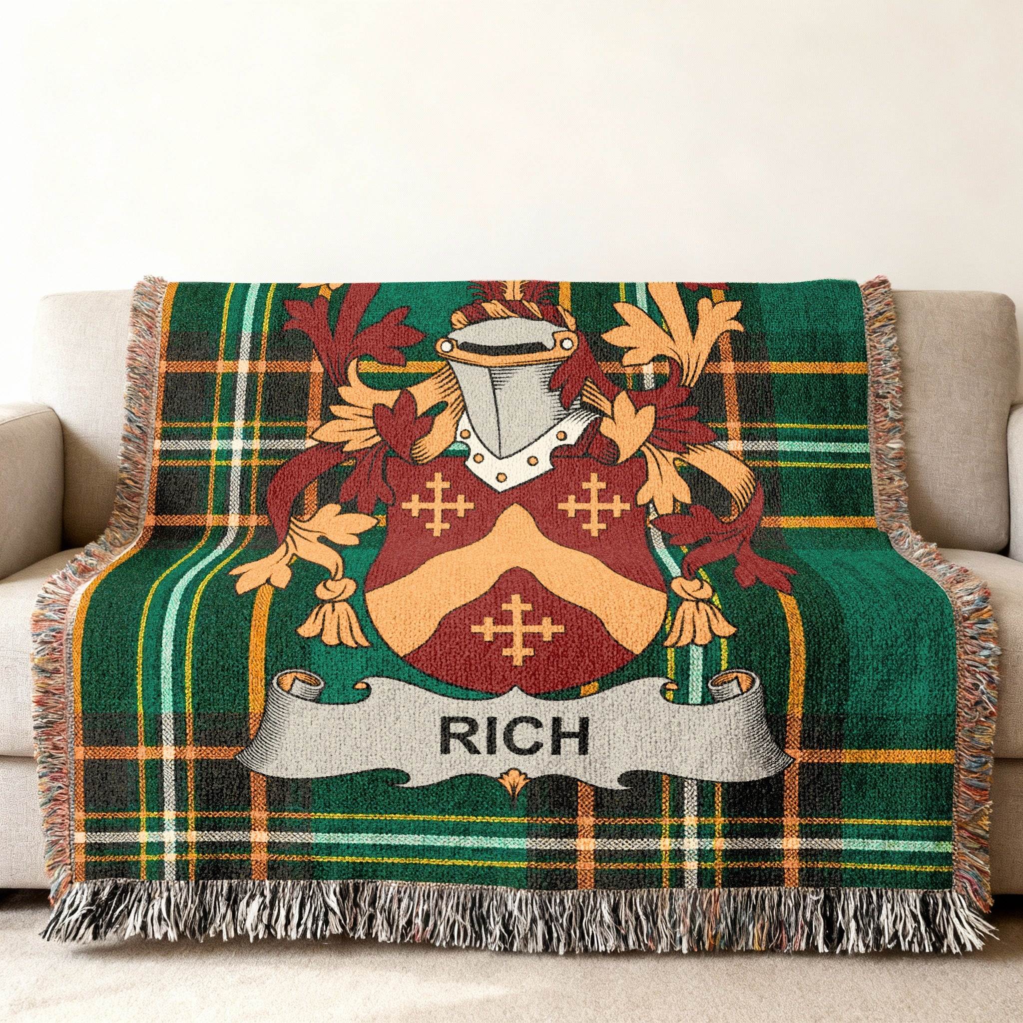 Woven blanket with green plaid and a central family crest displaying the name "RICH".