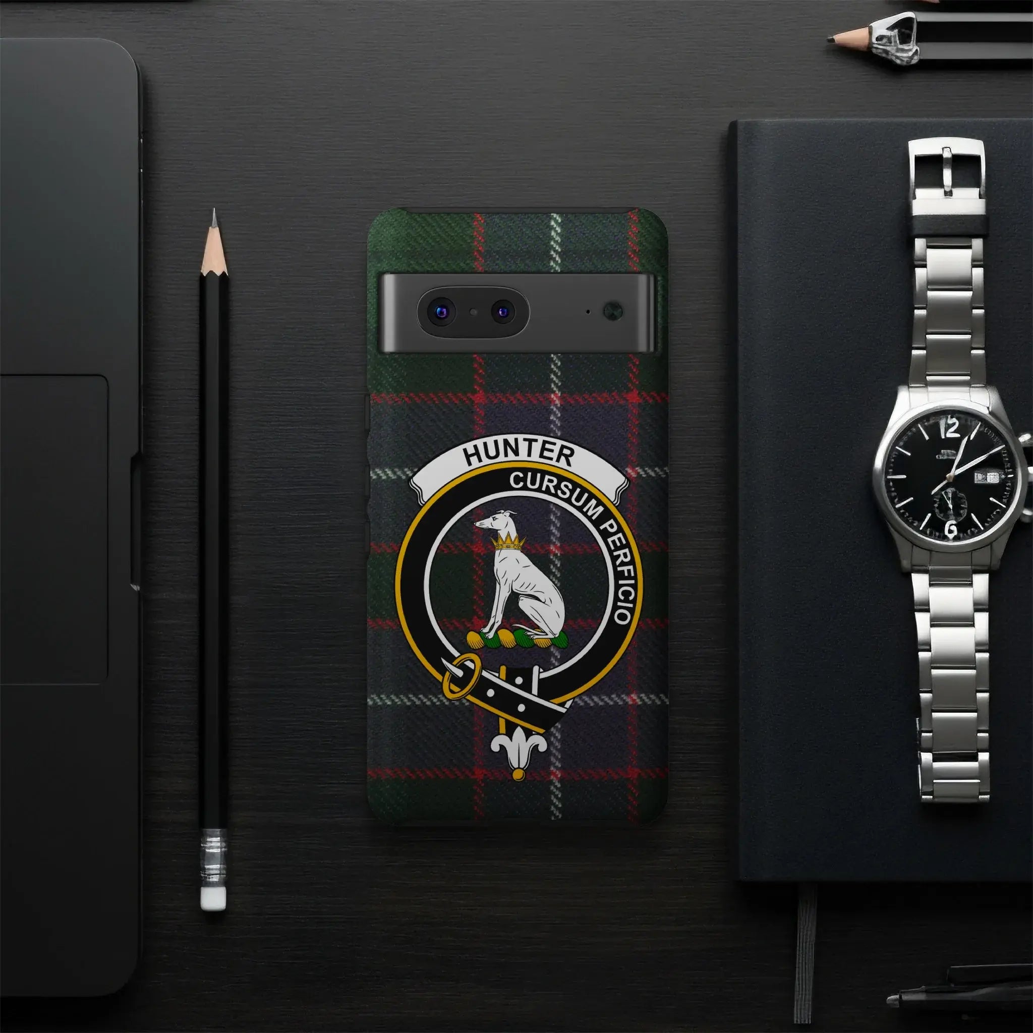 Hunter Cursum Perficio tartan phone case flat lay — full greyhound clan crest design visible