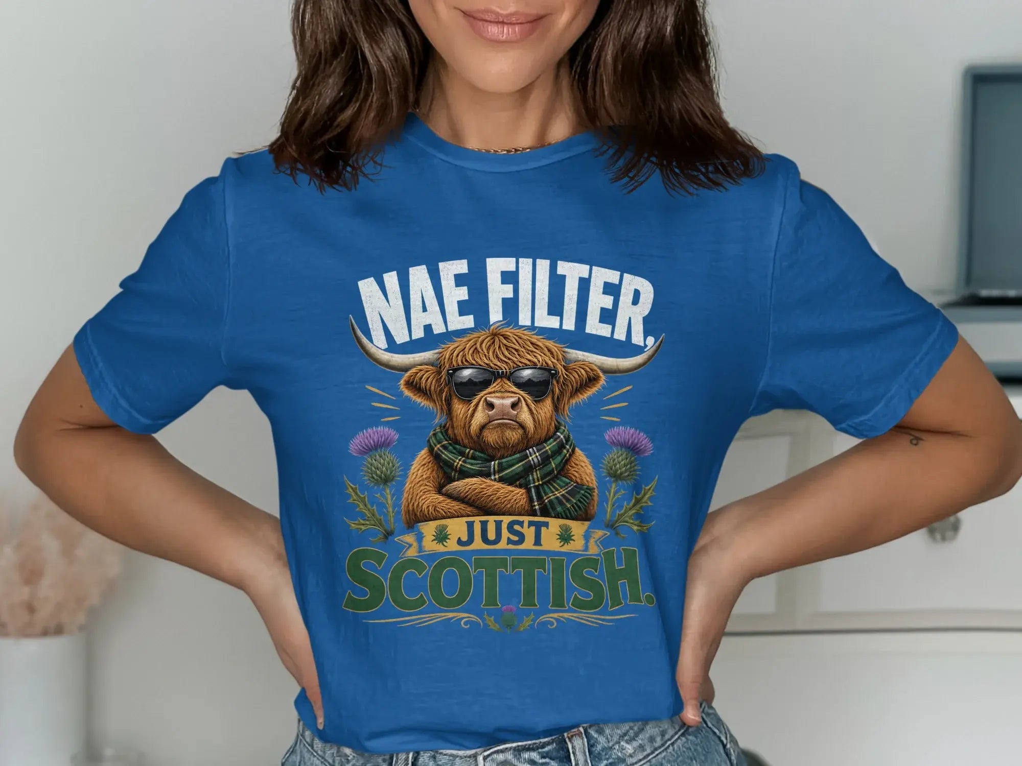 Highland cow wearing sunglasses and a scarf, text "Nae Filter Scottish".