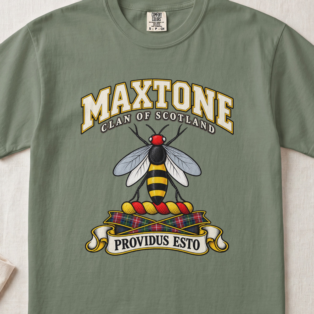 Maxtone Scottish clan T-shirt in Moss, front view with a black-and-gold bee with silver wings and motto banner.